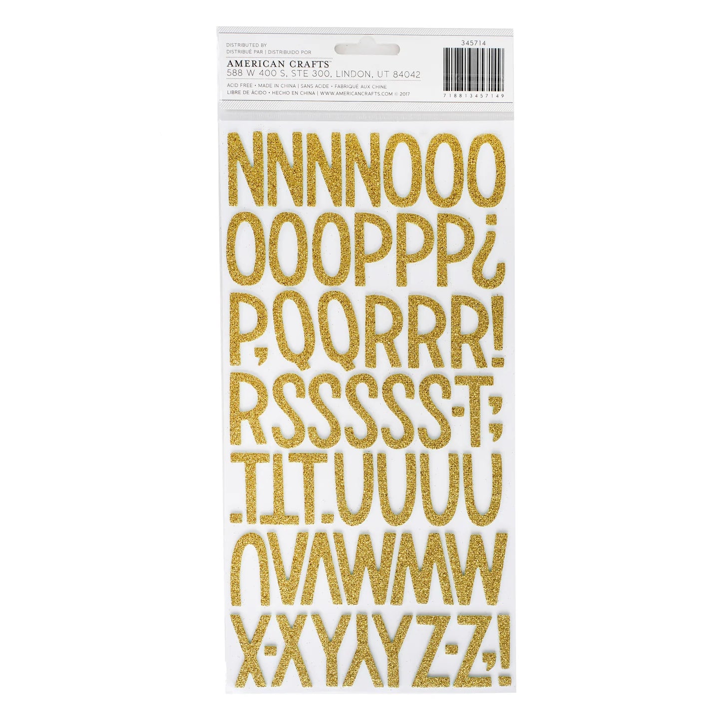 Gold glitter letter stickers on a white backing with &