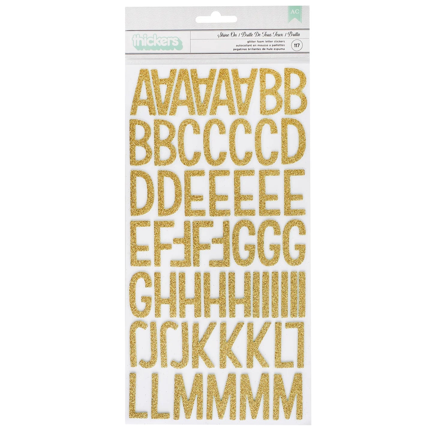 Packaging of gold glittery letter stickers on a white background