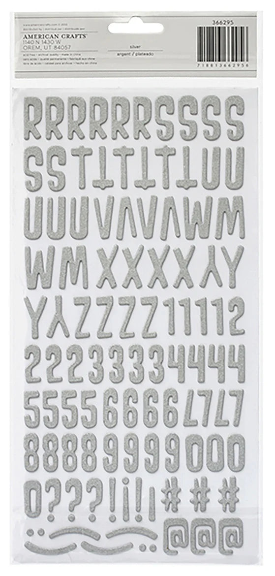 Alphabet and number stickers on a white background with &