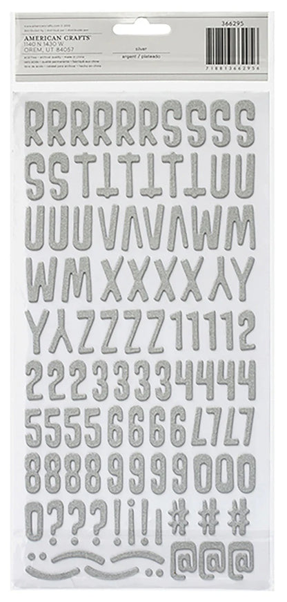 Alphabet and number stickers on a white background with &