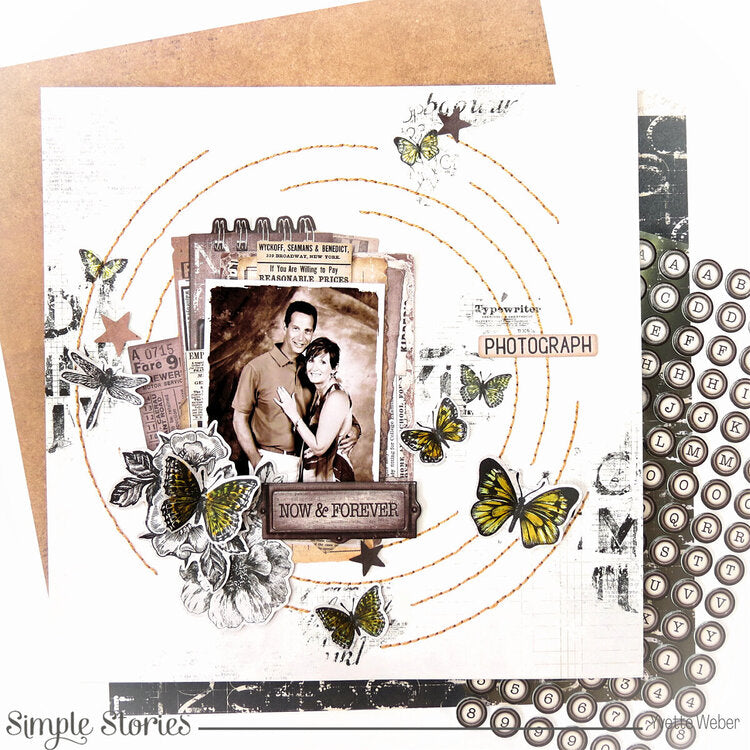 Scrapbooking layout with a couple photo, butterflies, and decorative elements on a white background.