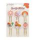 Set of colorful paper clips with decorative designs on a Groovy Darlin&